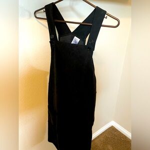 Black corduroy overall dress by From Rachel